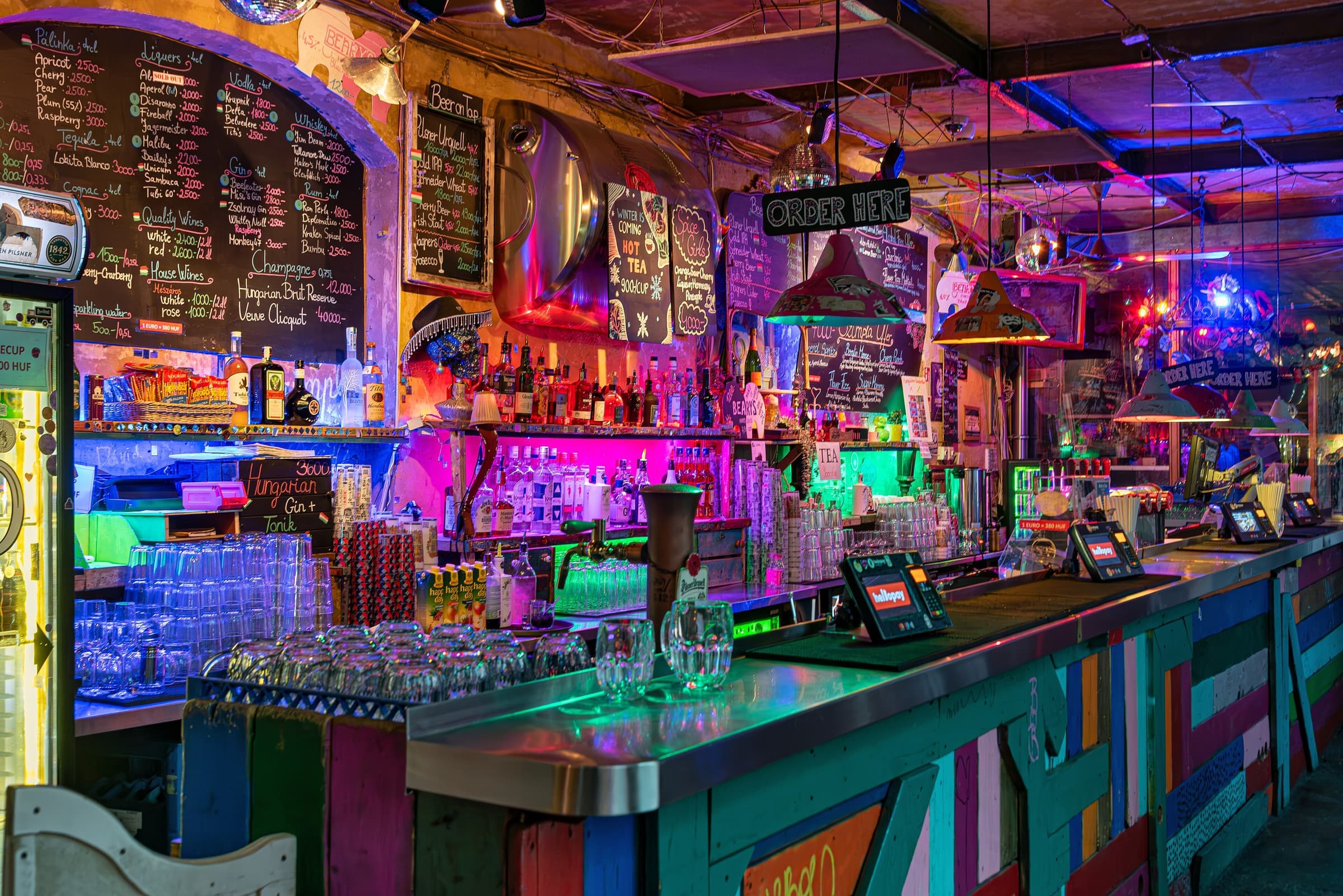 A Budapest ruin bar glowing with colour at night
